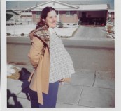 Kathie pregnant with April in front of Roy home